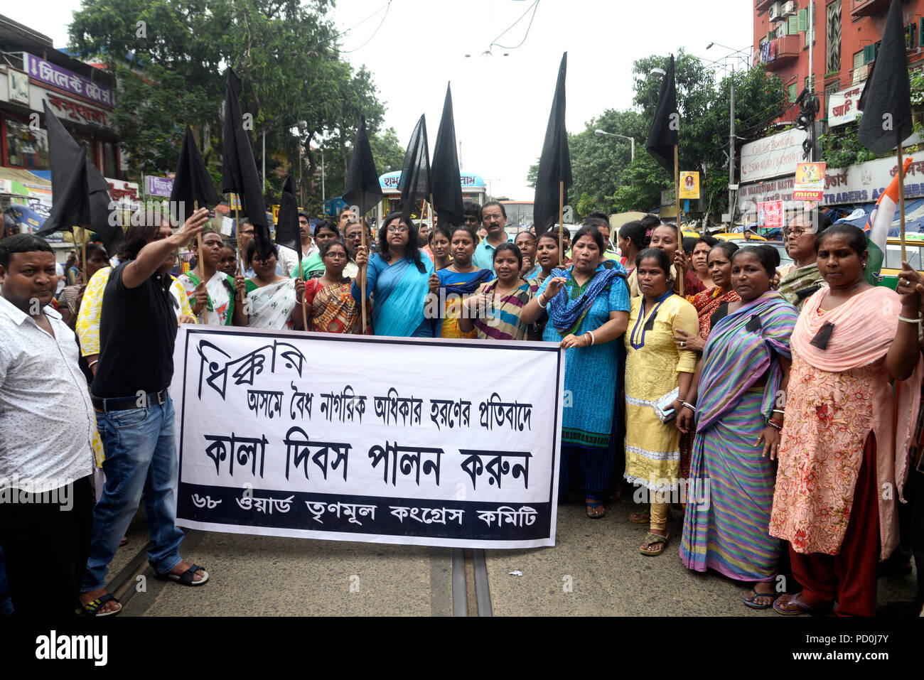 Kolkata, India. 04th Aug, 2018. TMC women activist holds black flag to protest against the manhandling and harassment of TMC delegation at Silchar Airport Trinamool Congress or TMC activist observe Black Day to protest against the manhandling and harassment of TMC delegation at Silchar Airport. Credit: Saikat Paul/Pacific Press/Alamy Live News Stock Photo