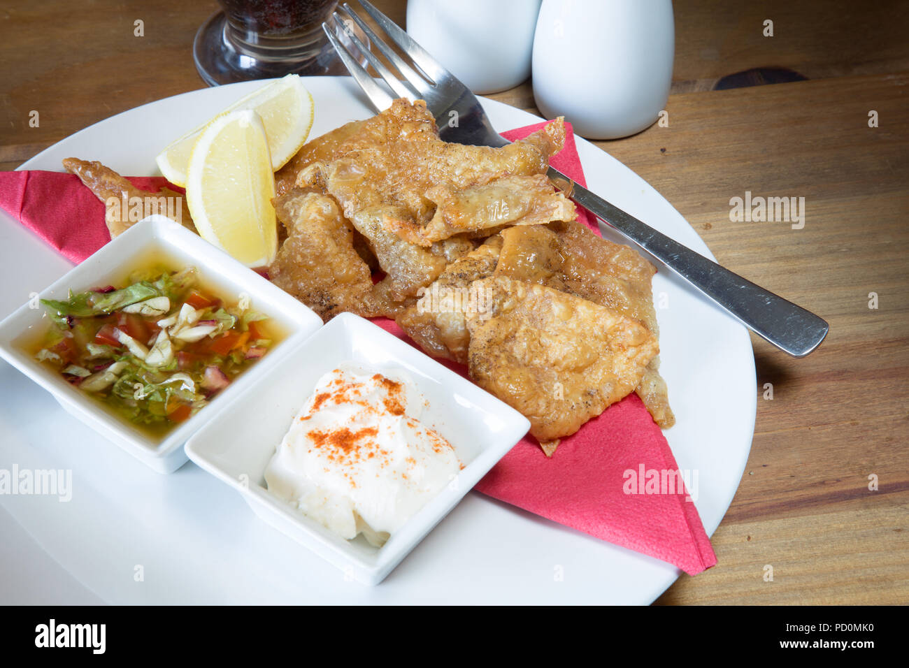 An English pub/restaurant entree dish of Roast Chicken skin with