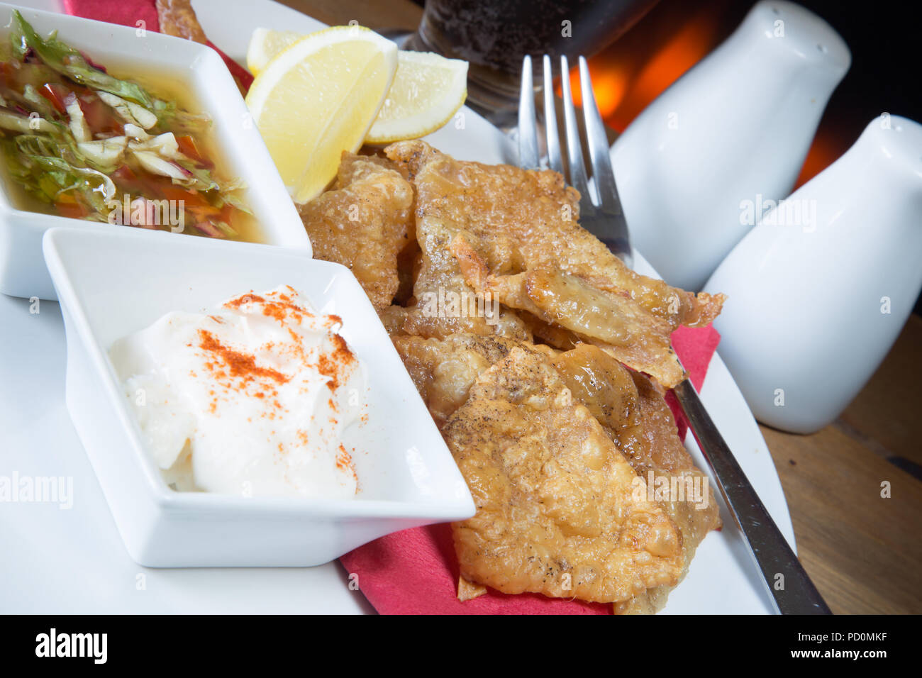 An English pub/restaurant entree dish of Roast Chicken skin with