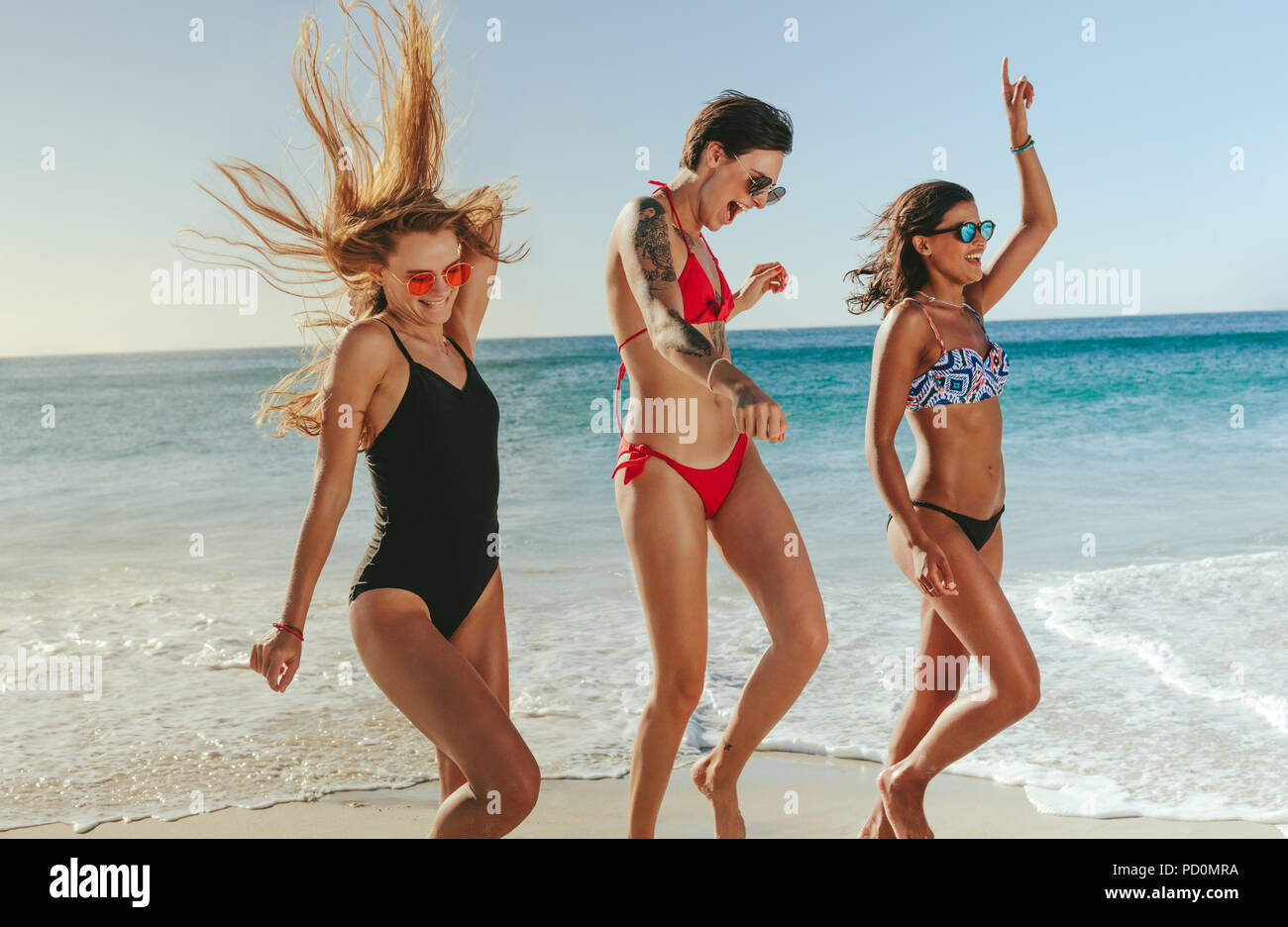 Girlfriends beach bikini hi-res stock photography and images - Alamy