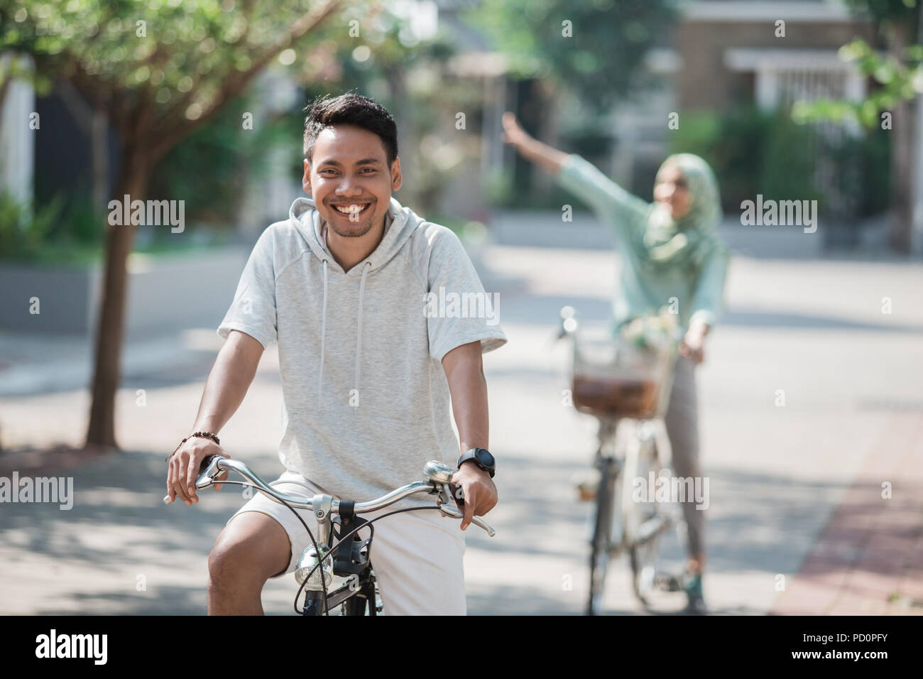 asian male riding a bike Stock Photo - Alamy