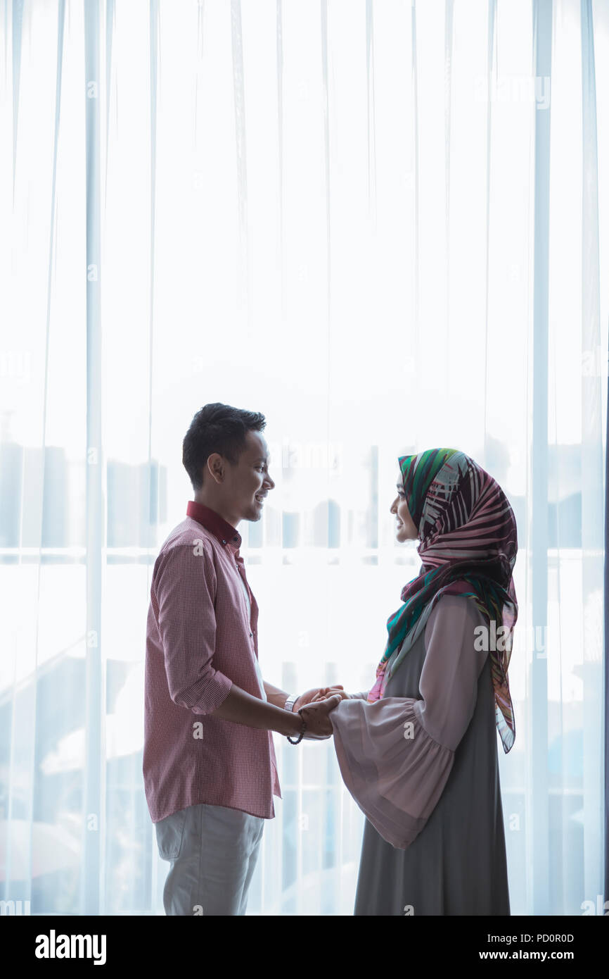romantic muslim couple holding hands Stock Photo - Alamy