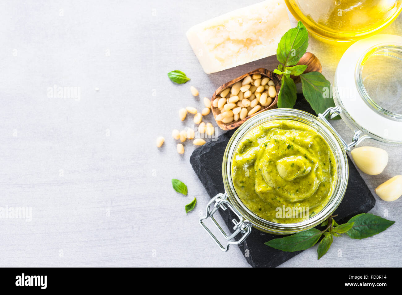 Pesto sauce in glass jar.  Stock Photo