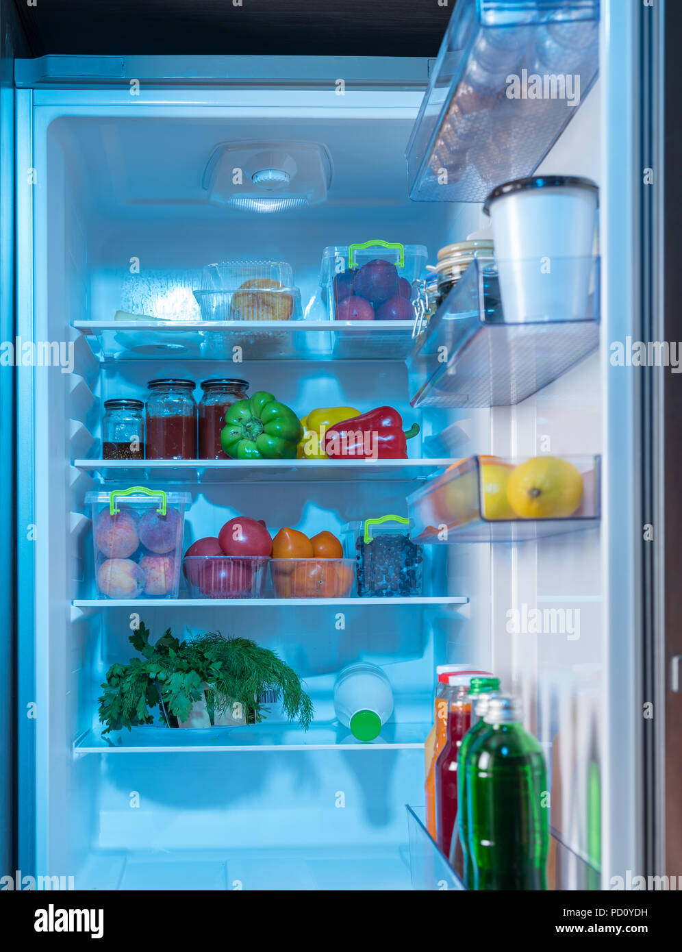 Open Fridge With Healthy Fresh Food Inside Including
