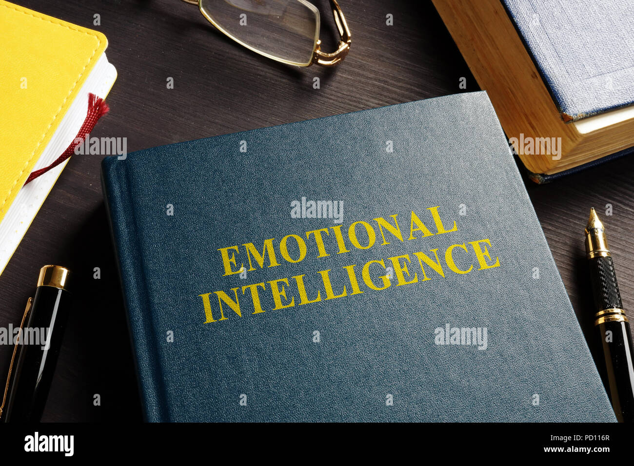 Book about Emotional intelligence EI on a desk. Stock Photo