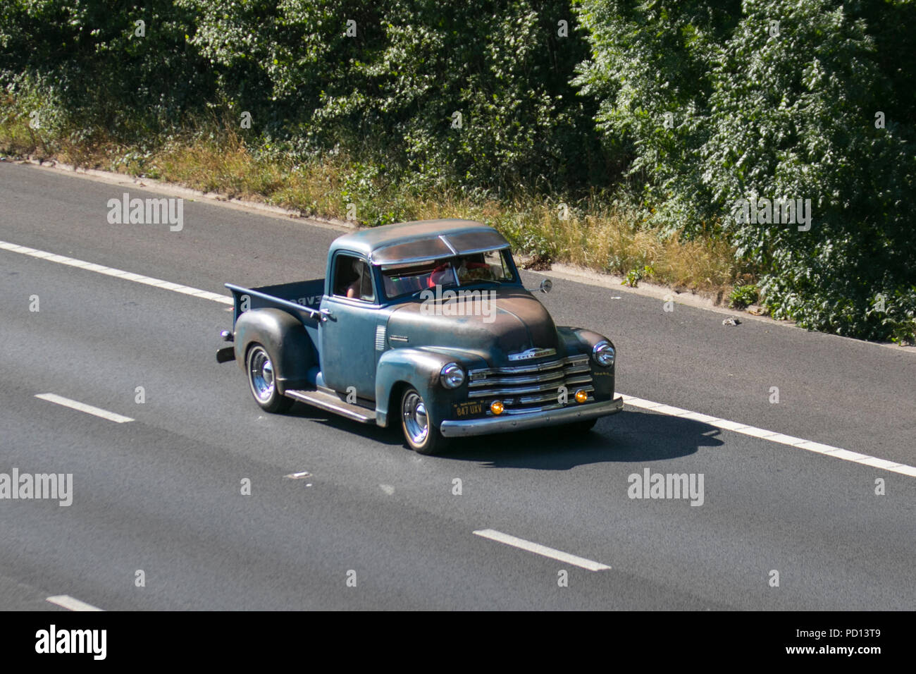 847UXV green 1951 Chevrolet SUV truck  UK Vehicular traffic, transport, collectible vehicles saloon cars, on the 3 lane M55 motorway highway, Blackpool, UK Stock Photo