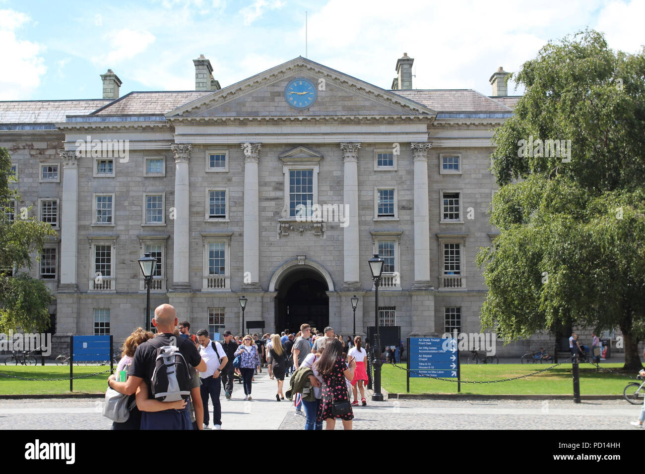 Trinity College, Dublin, Ireland, the rear of the main entrance with tourists streaming in to view the historic building which dates back to c1592. Stock Photo