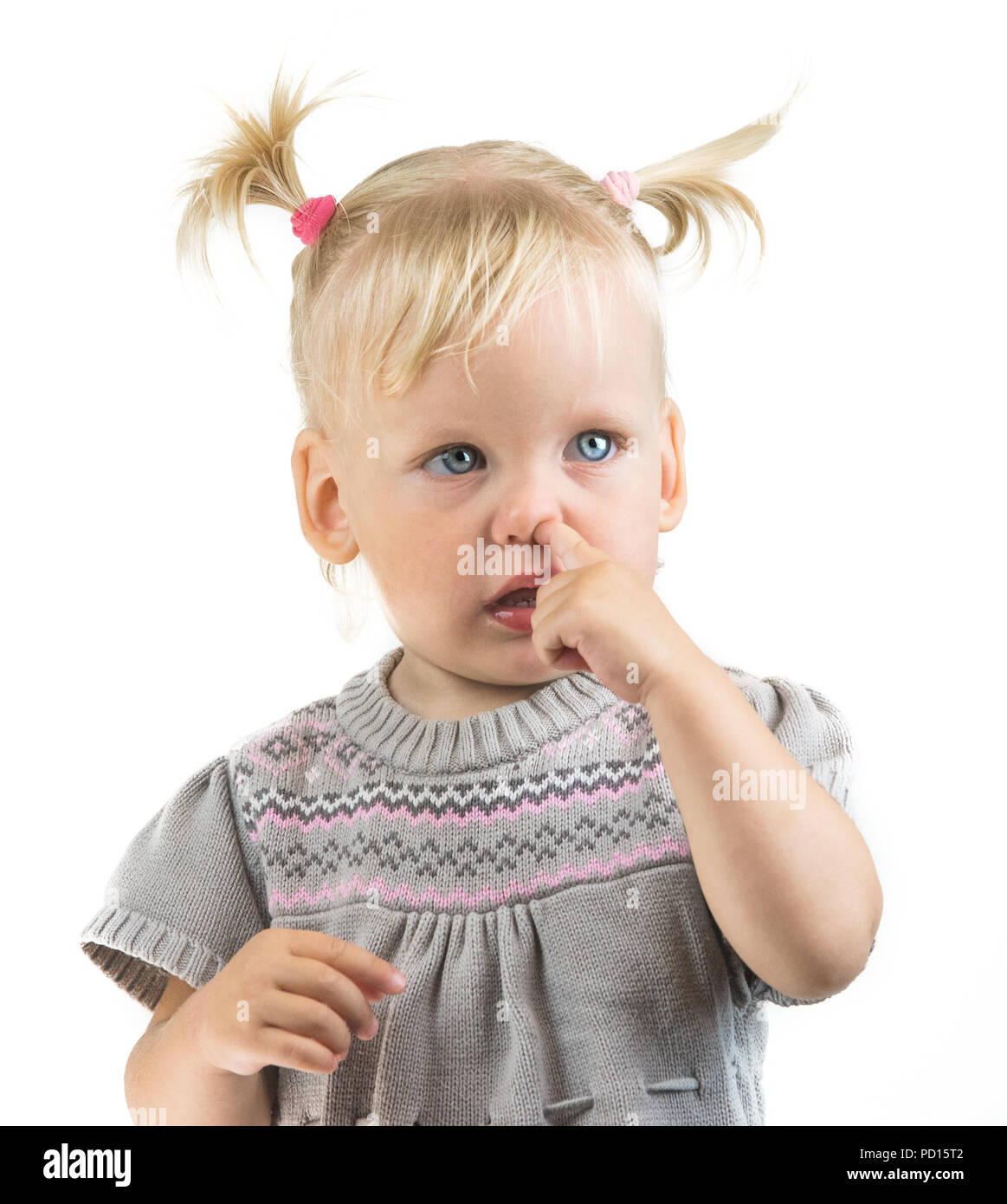 baby picking nose child portrait Stock Photo