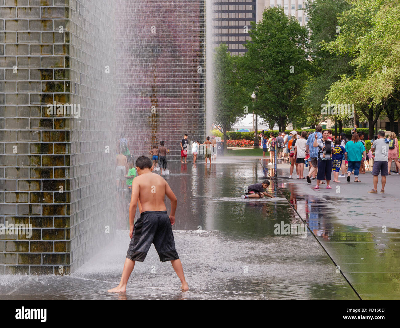 Children playing in  Crown Fountain, Millennium Park, Chicago, Illinois. Stock Photo