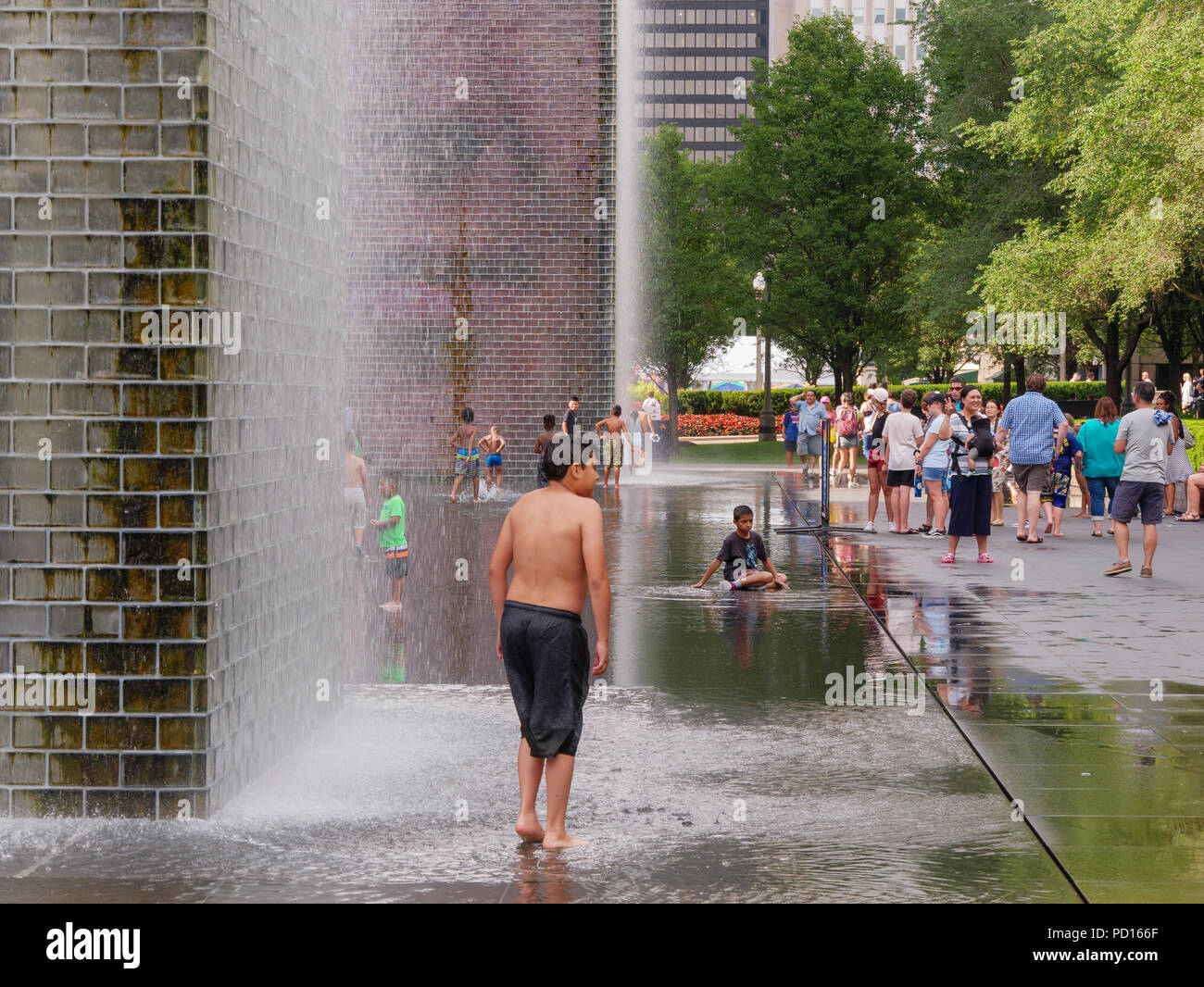 Children playing in  Crown Fountain, Millennium Park, Chicago, Illinois. Stock Photo