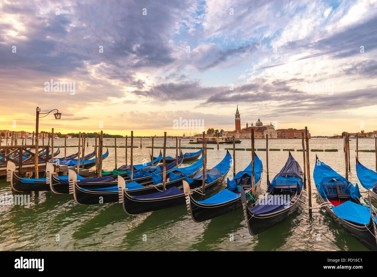 Venice sunrise city skyline and Venice Gondola boat, Venice Italy Stock Photo