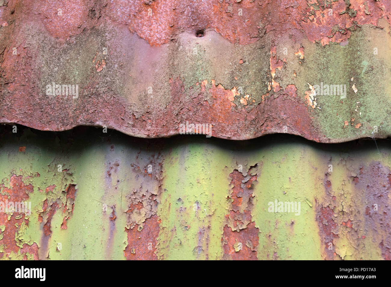 Rusting Corrugated sheets on a farm building as a background Stock Photo