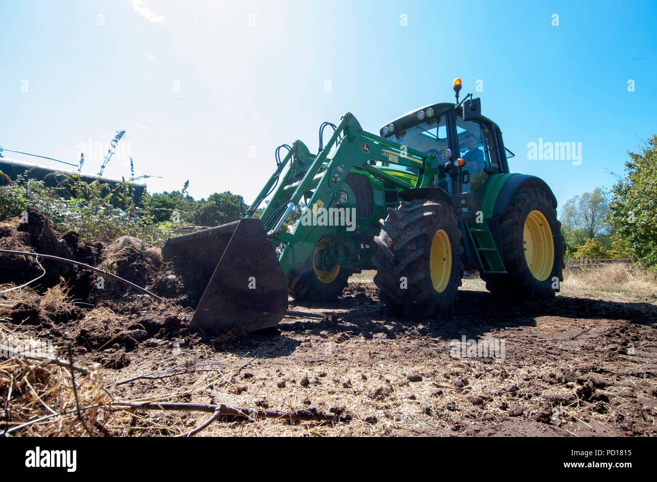 John Deere 6430 Tractor Fitted with JD 633 loader. Stock Photo