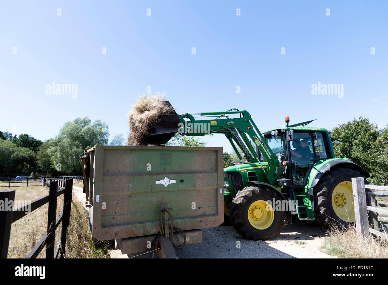 John Deere 6430 Tractor Fitted with JD 633 loader. Stock Photo