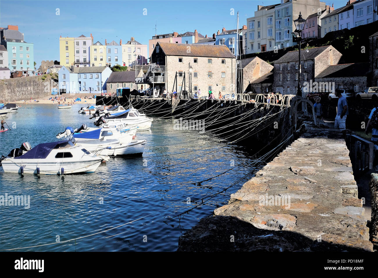 Tenby, Pembrokeshire, South Wales, UK. July 25, 2018.  Rows of mooring ropes from the quay in the harbor at Tenby in South Wales, UK. Stock Photo