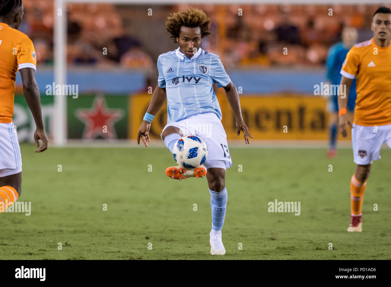 Houston, USA. 4 August 2018.  16 year old Sporting KC midfielder Gianluca Busio (13) controls the ball during an MLS soccer match between the Houston Dynamo and Sporting Kansas City at BBVA Compass Stadium in Houston, TX. Busio became the third-youngest player to ever start an MLS game. Kansas City won the match 1 to 0.Trask Smith/CSM Credit: Cal Sport Media/Alamy Live News Stock Photo