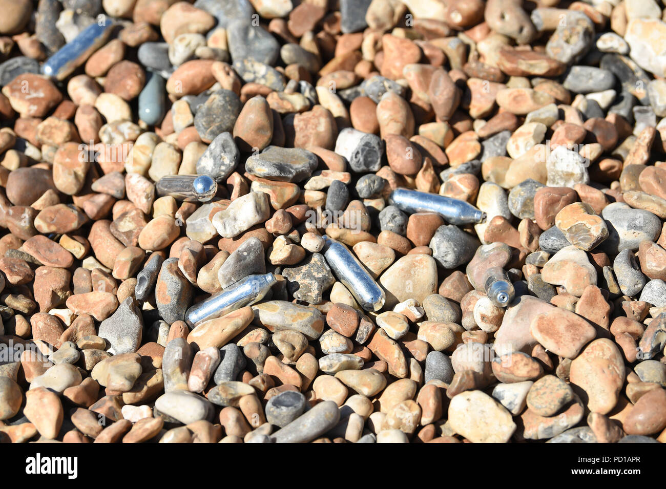 Brighton UK 5th August 2018 Gas canisters amongst rubbish on Brighton