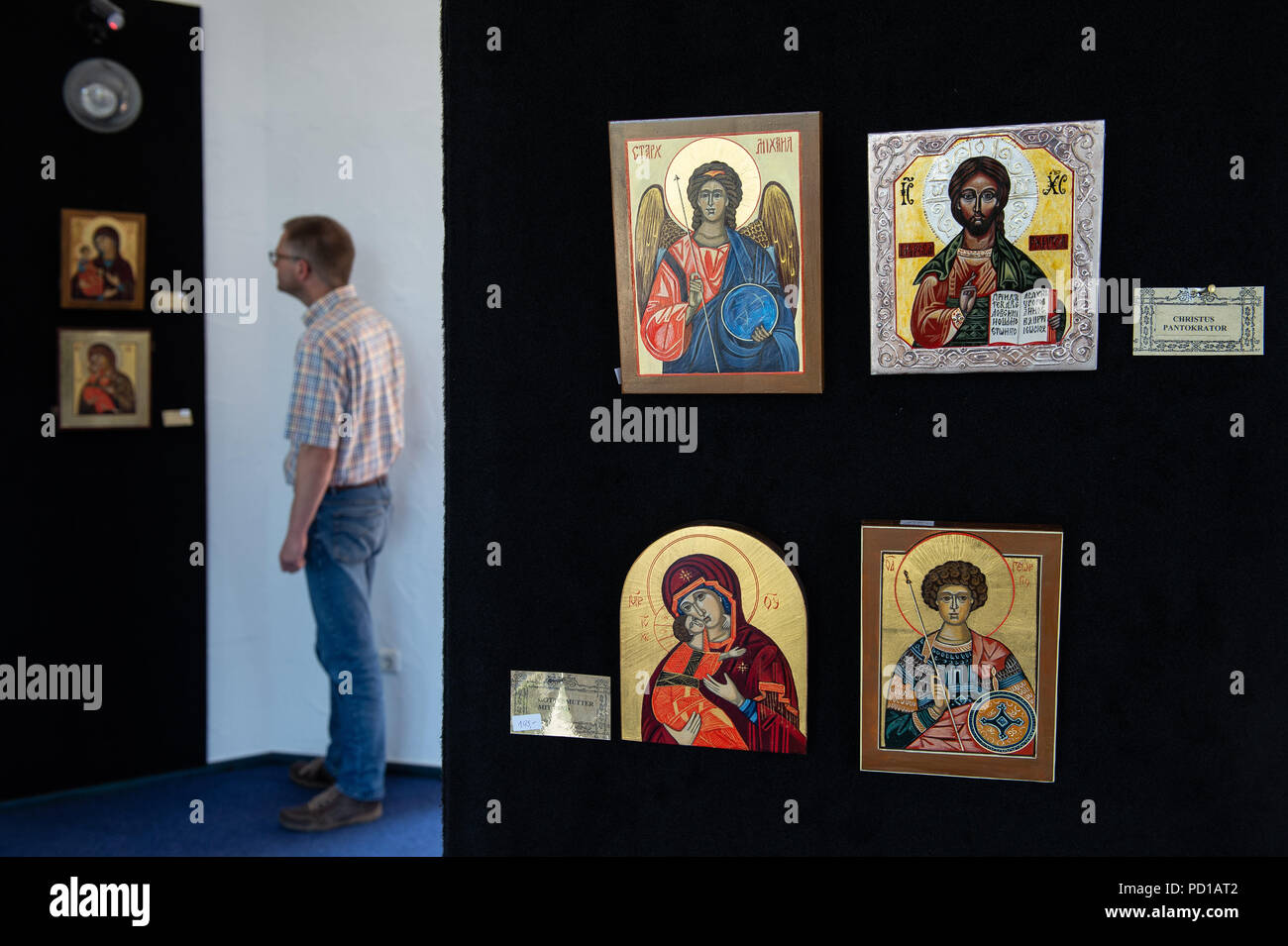 Gifhorn, Germany. 03rd Aug, 2018. The icons 'Christ Pantocrator' (above) and 'Mother of God with Child' are on display at the Bell Palace. Until 30 September 2018, various expressive icons of Russian and Greek painting techniques will be on display. Credit: Swen Pfšrtner/dpa/Alamy Live News Stock Photo