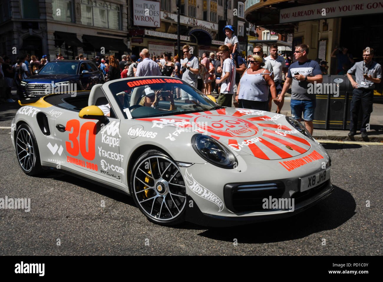 London, UK. 5 August 2018. A Porsche sets off from the start. Gumball 3000,  a charity rally for supercars and more, including celebrity entrants,  begins in Covent Garden with 150 participants beginning