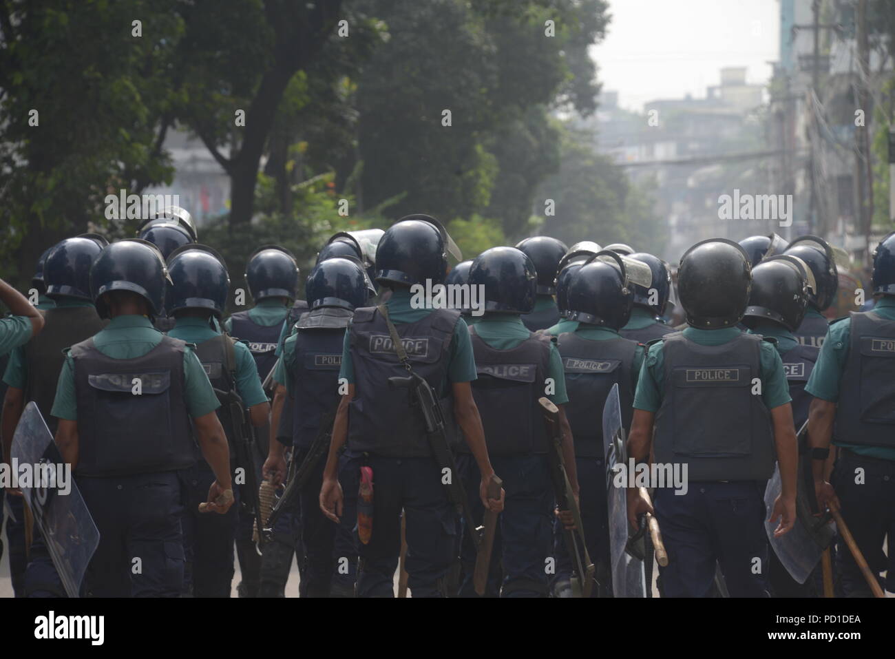 Dhaka. 5th Aug, 2018. Anti-riot policemen stand guard during protest of students on a major road in Dhaka, Bangladesh on Aug. 5, 2018. Credit: Xinhua/Alamy Live News Stock Photo