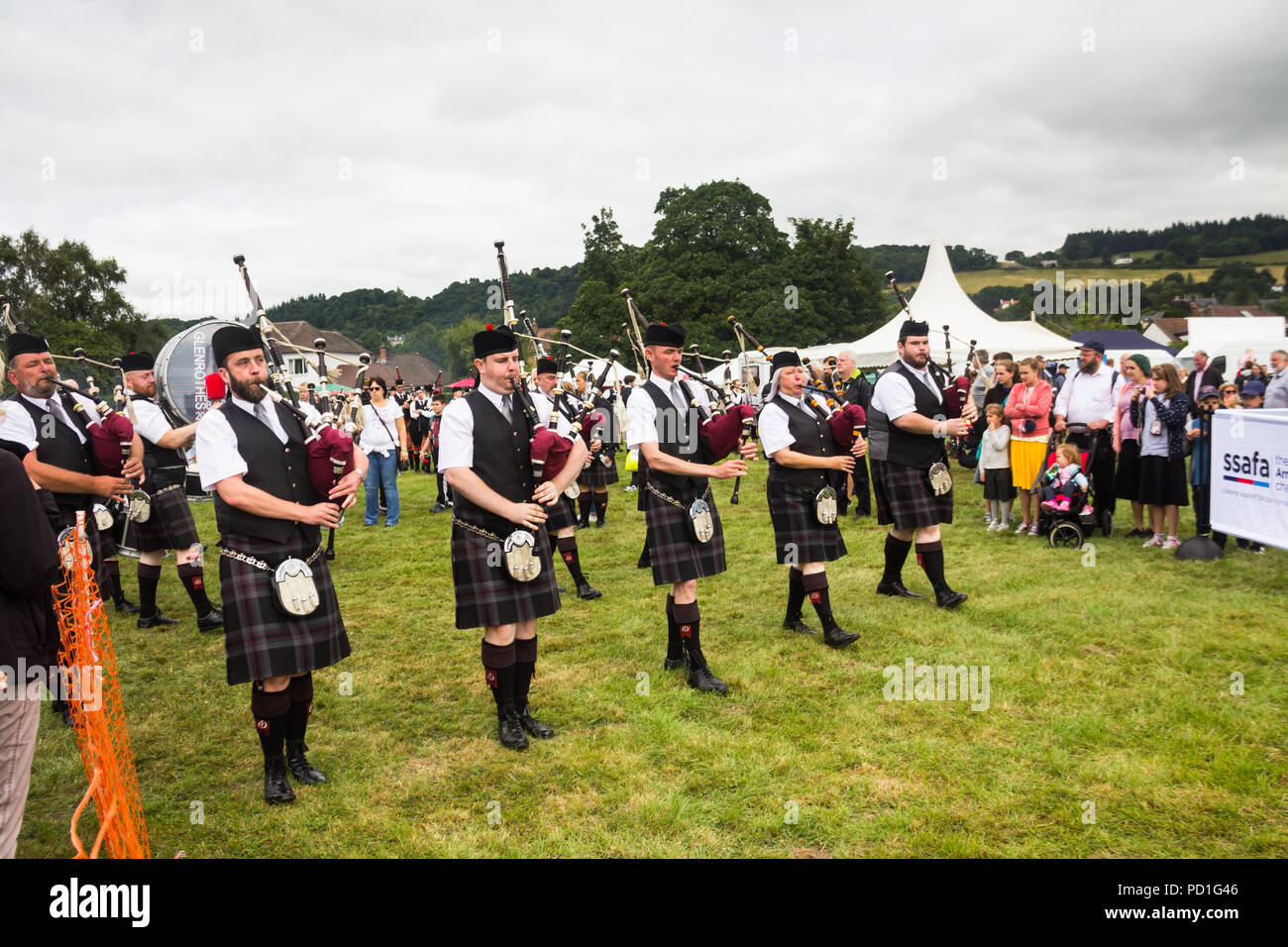 Stirling, Scotland, UK. 5th August 2018. Strathallan Games Park near Stirling is the venue for the 167th Bridge of Allan Highland Games.  Members of the Glenrothes and District Pipe Band march towards the main show ring to take part in the pipe band competition. Credit Joseph Clemson, JY News Images/Alamy Live News. Stock Photo