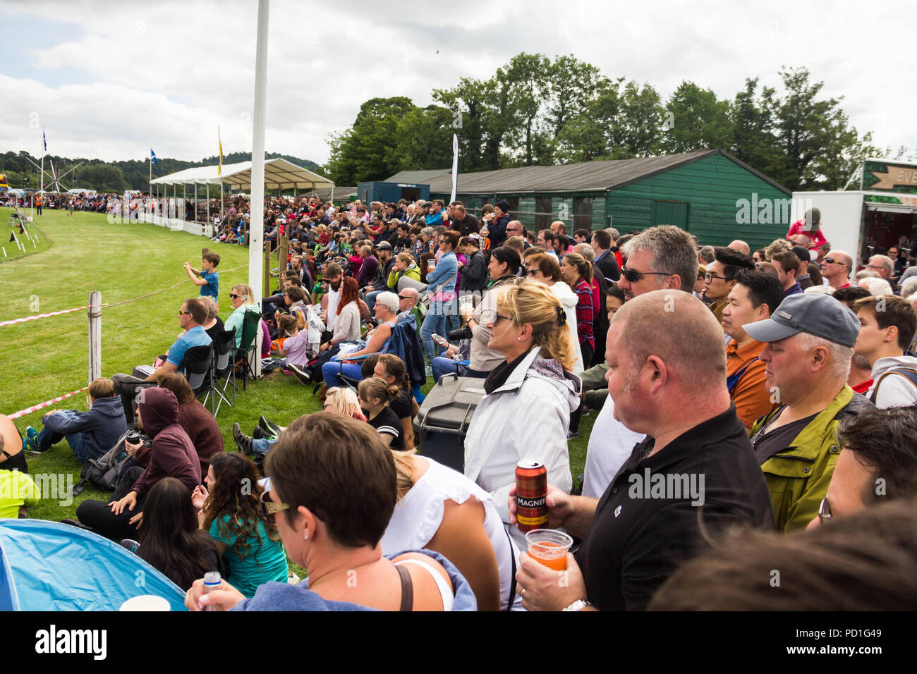 Stirling, Scotland, UK. 5th August 2018. Spectators around the main show ring at Strathallan Games Park near Stirling, the venue for the 167th Bridge of Allan Highland Games.  Crowds have gathered to watch highland dancing, the pipe band competion, athletics, cycle racing and the traditional heavywight contests including tossing the caber.  Credit Joseph Clemson, JY News Images/Alamy Live News. Stock Photo