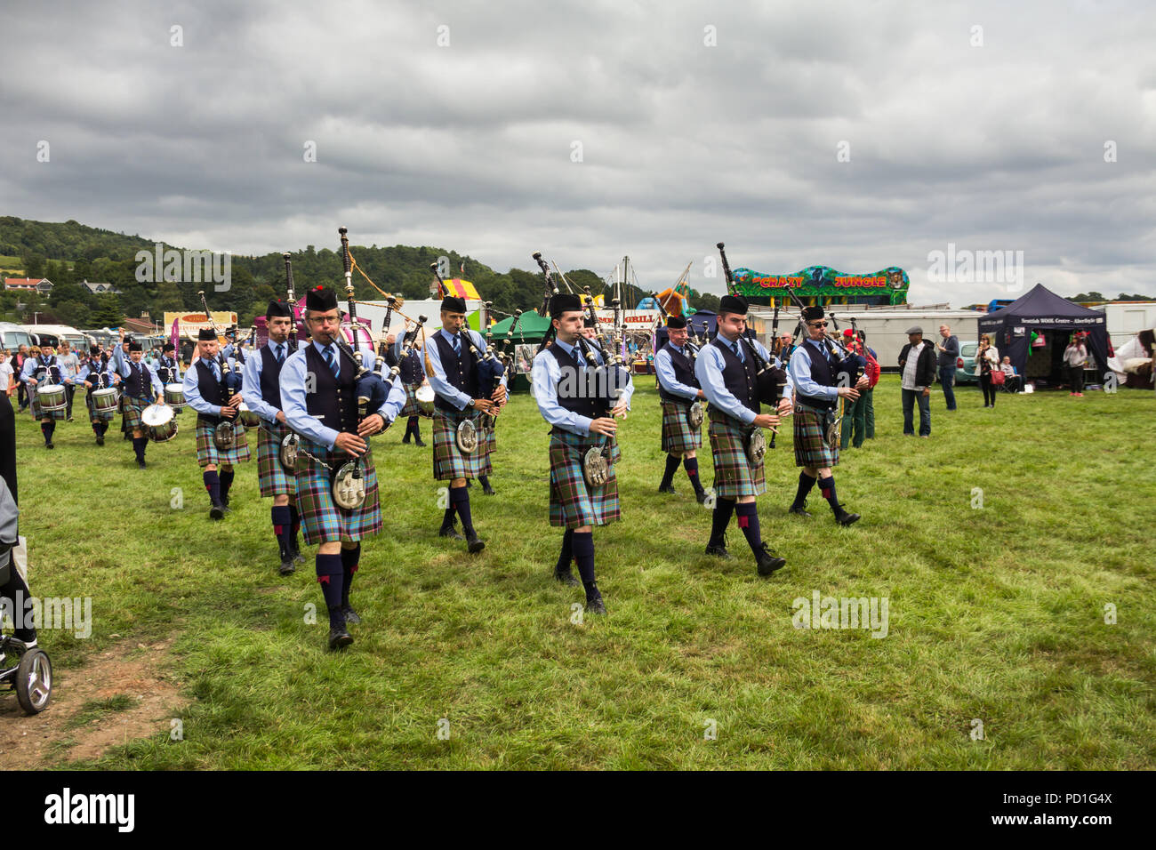 Stirling, Scotland, UK. 5th August 2018. Strathallan Games Park near Stirling is the venue for the 167th Bridge of Allan Highland Games.  Members of the Royal Burgh of Stirling Pipe Band play traditional Scottish bagpipes and drums as they march across the showground. In competions like today they wear their number 2 uniform with the Stirling and Bannockburn Caledonian Society tartan. Credit Joseph Clemson, JY News Images/Alamy Live News. Stock Photo