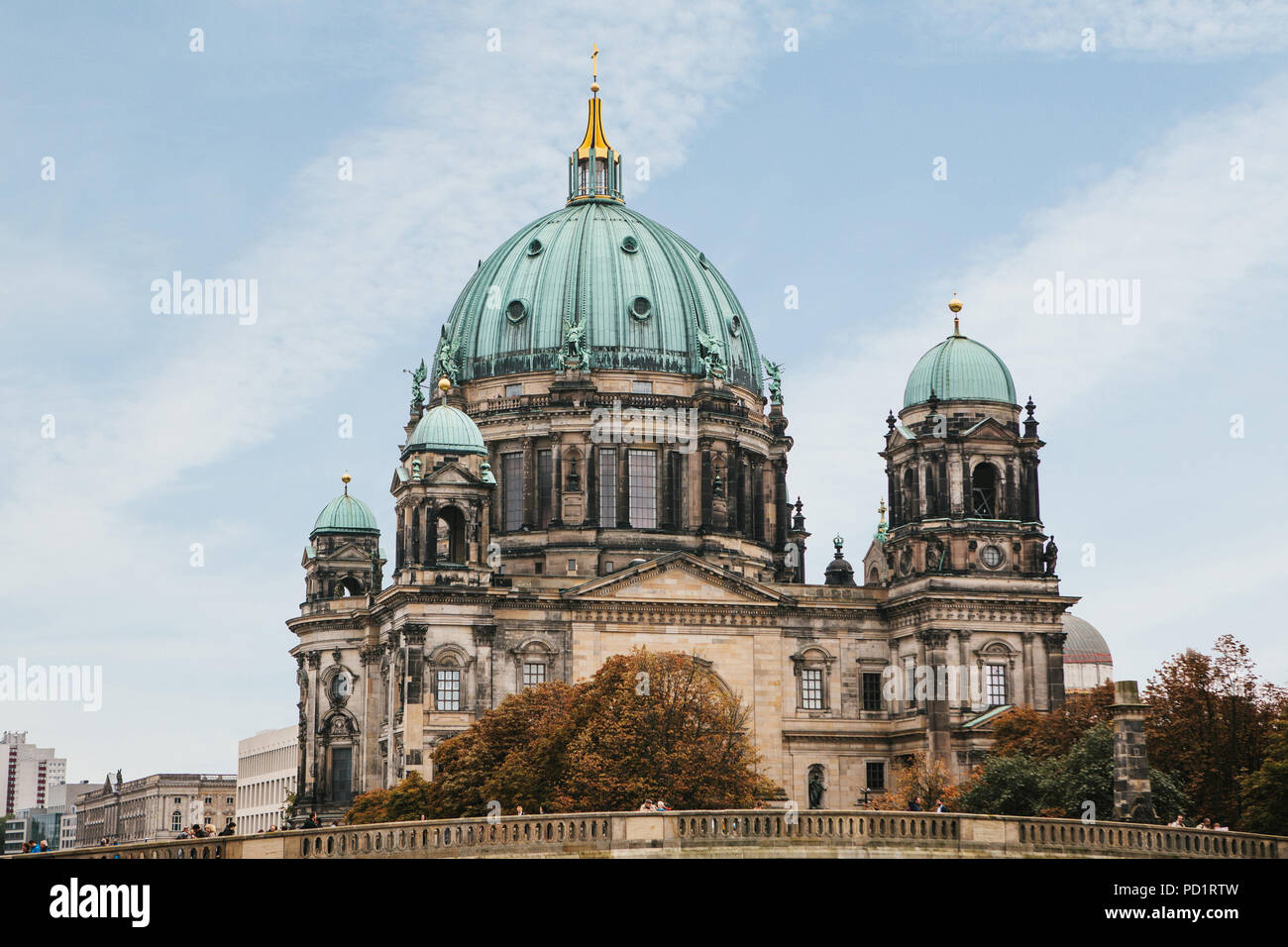 The Berlin Cathedral is called Berliner Dom against the blue sky. Beautiful old building in the style of neoclassicism and baroque with cross and sculptures. Berlin, Germany Stock Photo
