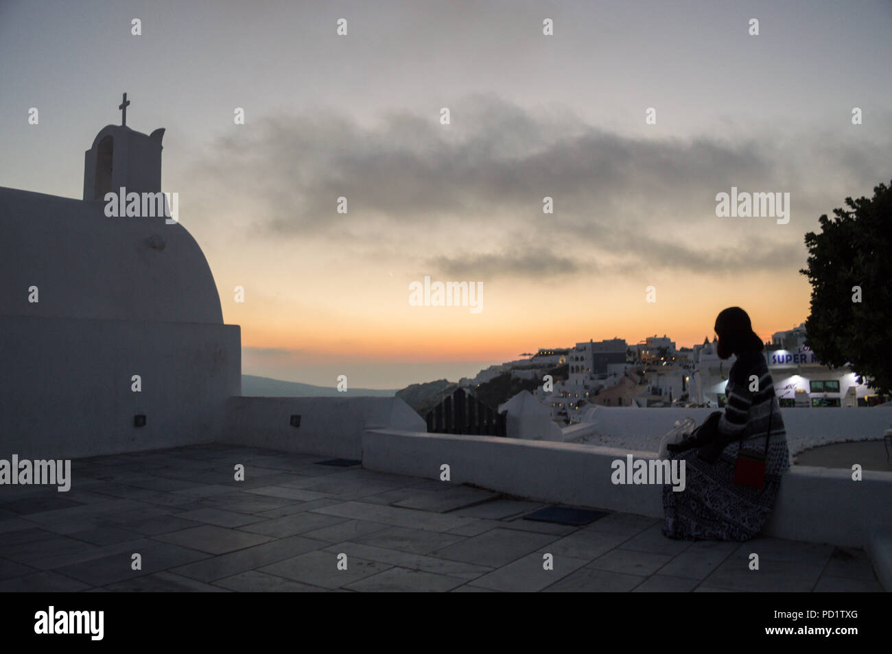 Woman watching sunset balcony hi-res stock photography and images - Alamy