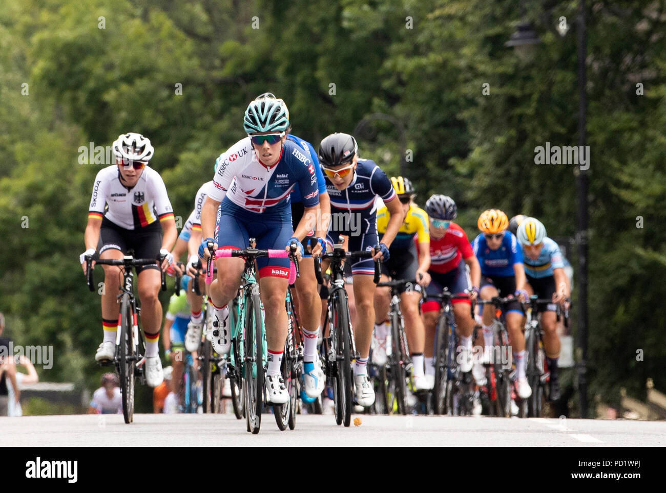 The peloton passes along University Avenue of the Womens 130km Road Race during day four of the 2018 European Championships at the Glasgow Cycling Road Race Course. Stock Photo