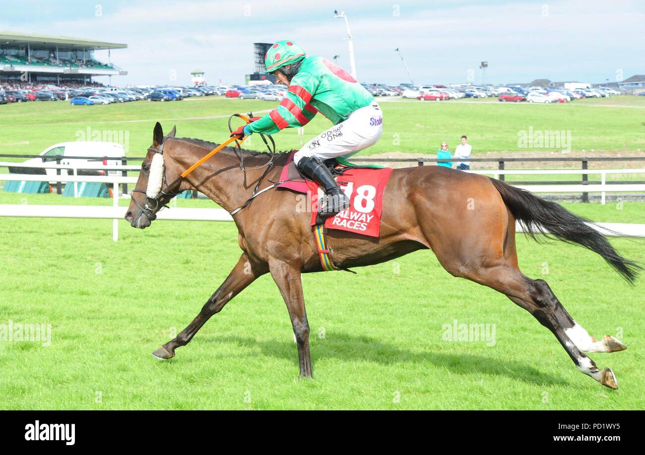 Show and Go ridden by Mark Enright win the Lord Hemphill Memorial Handicap Chase during day seven of the Galway Summer Festival at Galway Racecourse. Stock Photo