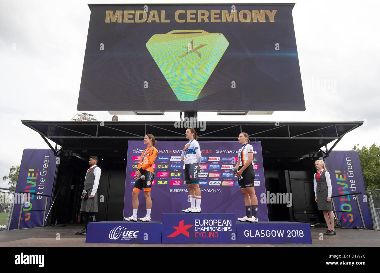 (from left) Silver Medal winner Netherland's Marianne Vos, Gold Medal winner Italy's Marta Bastianelli and Bronze Medal winner Germany's Lisa Brennauer on the podium after the Womens 130km Road Race during day four of the 2018 European Championships at the Glasgow Cycling Road Race Course. Stock Photo