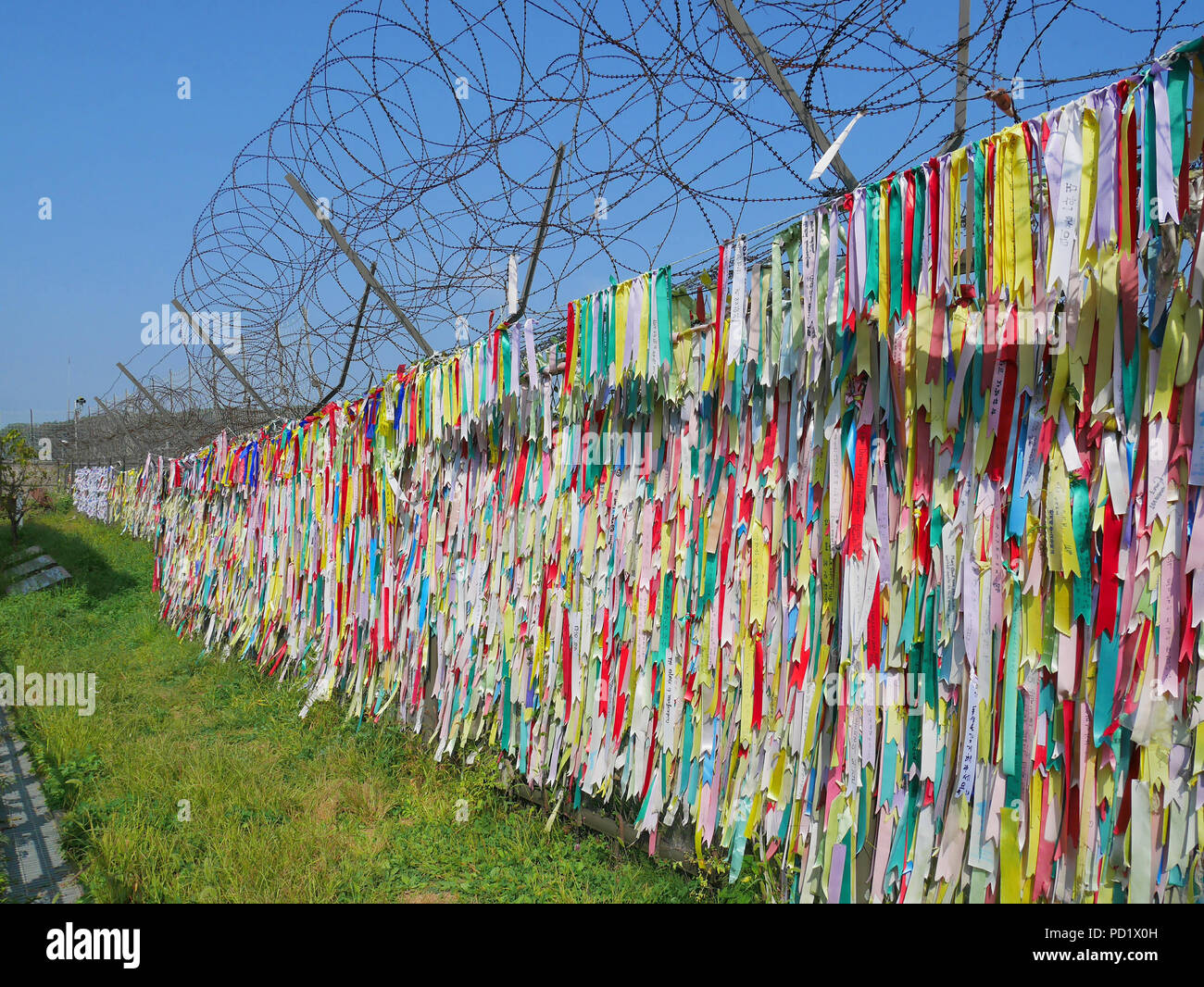 PAJU, SOUTH KOREA - SEPTEMBER 26, 2017: Colorful prayer ribbons at Imjingak Park near DMZ or demilitarized zone. South Koreans tie these ribbons with  Stock Photo