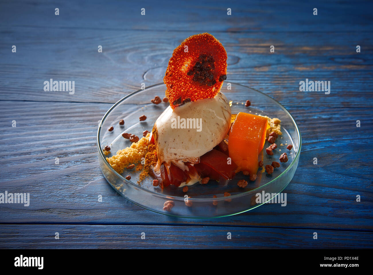 Modern cuisine ice cream dessert with quince vanilla and crunchy Stock