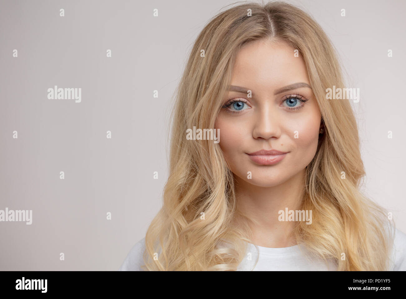 blond model with beautiful facial features.copy space. isolated white background Stock Photo Alamy