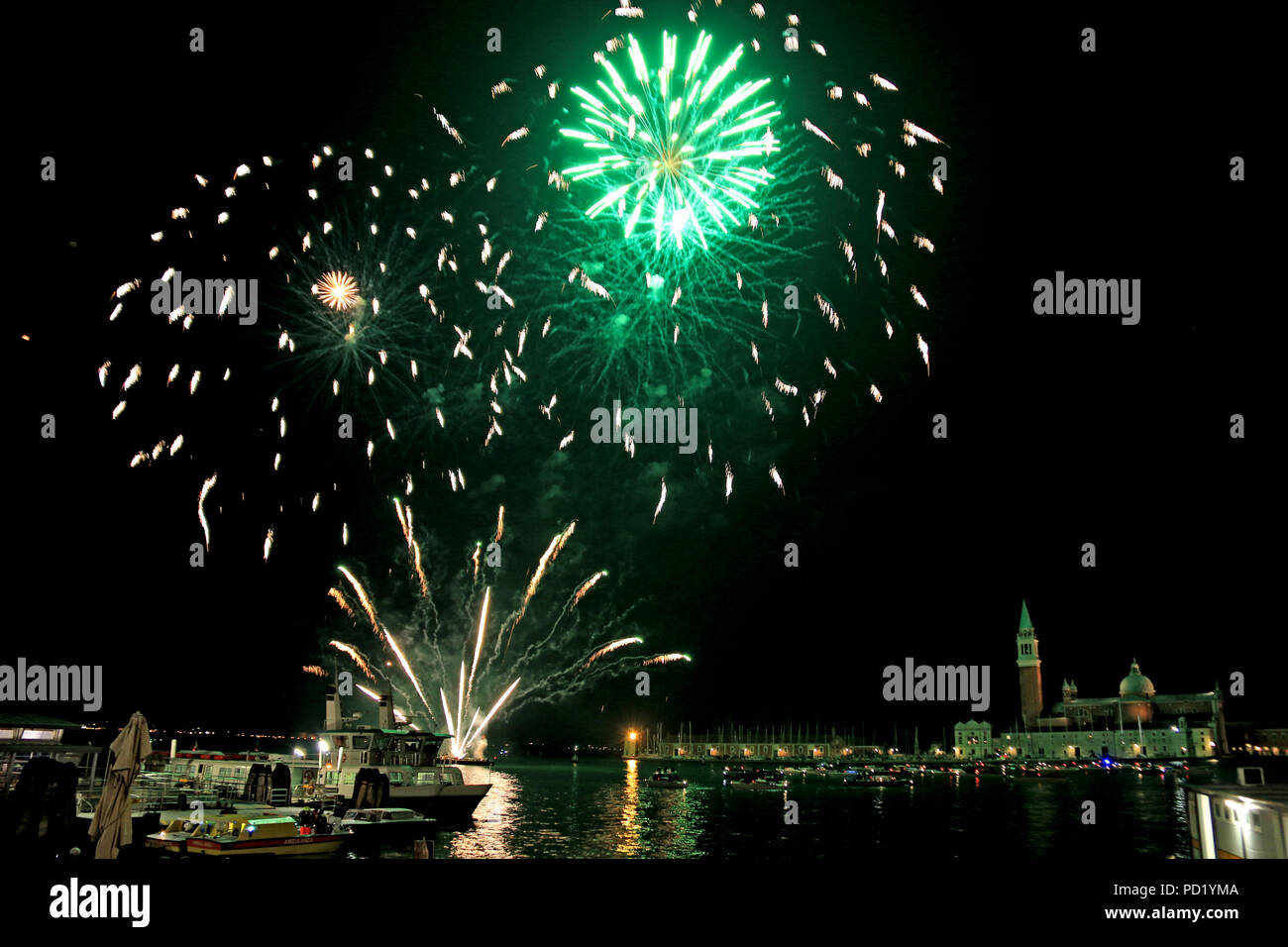 New Year's Eve Firework illuminating the sky around the Venetian Lagoon, Venice, Italy, with the island of San Giorgio Maggiore in the background Stock Photo
