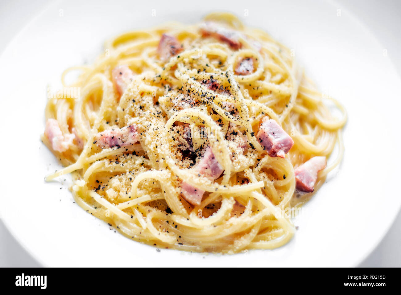 spaghetti pasta carbonara with bacon ham cream and kampot pepper dish Stock Photo