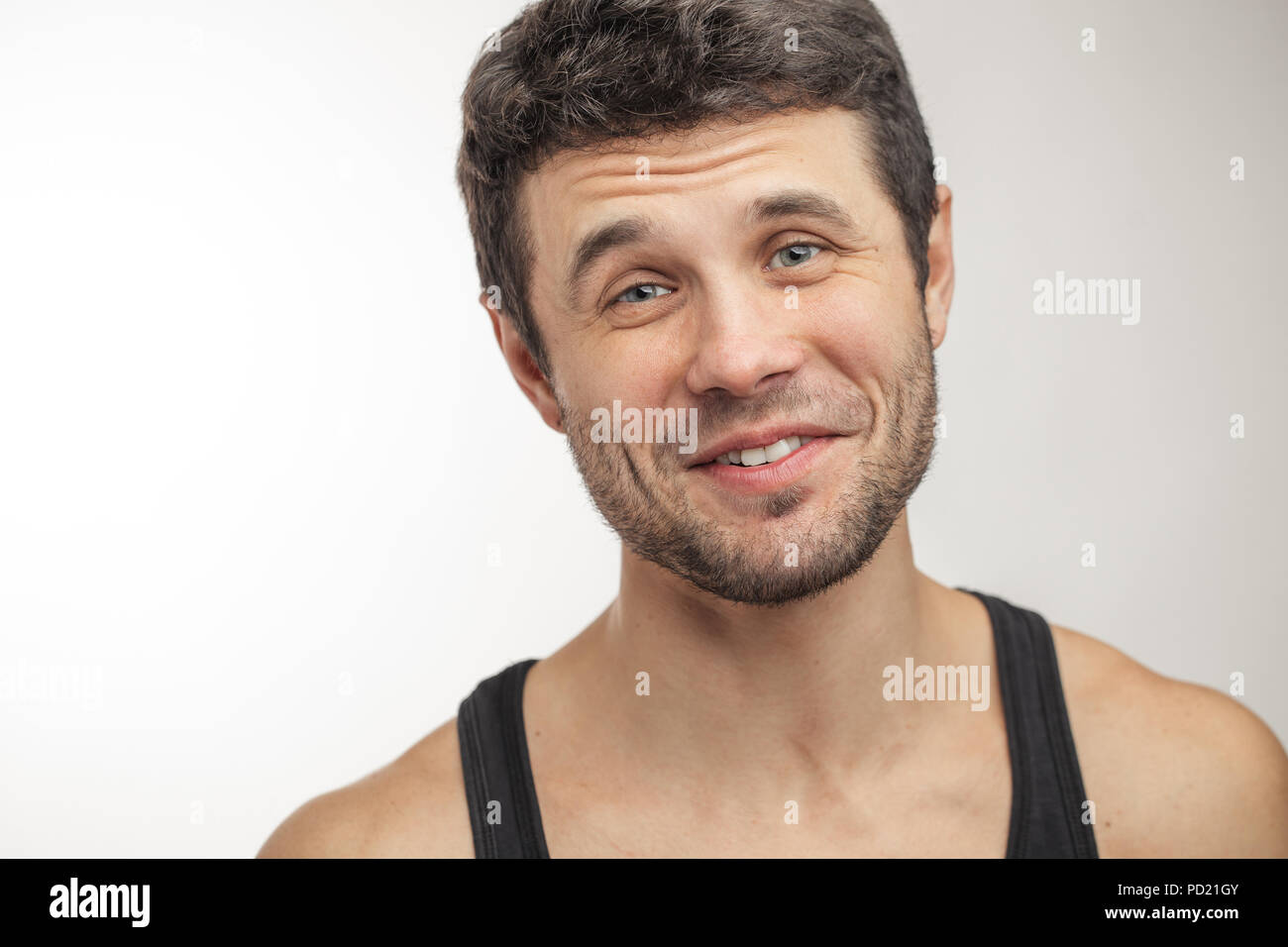friendly unshaven man with positive expression. close-up portrait. copy space Stock Photo