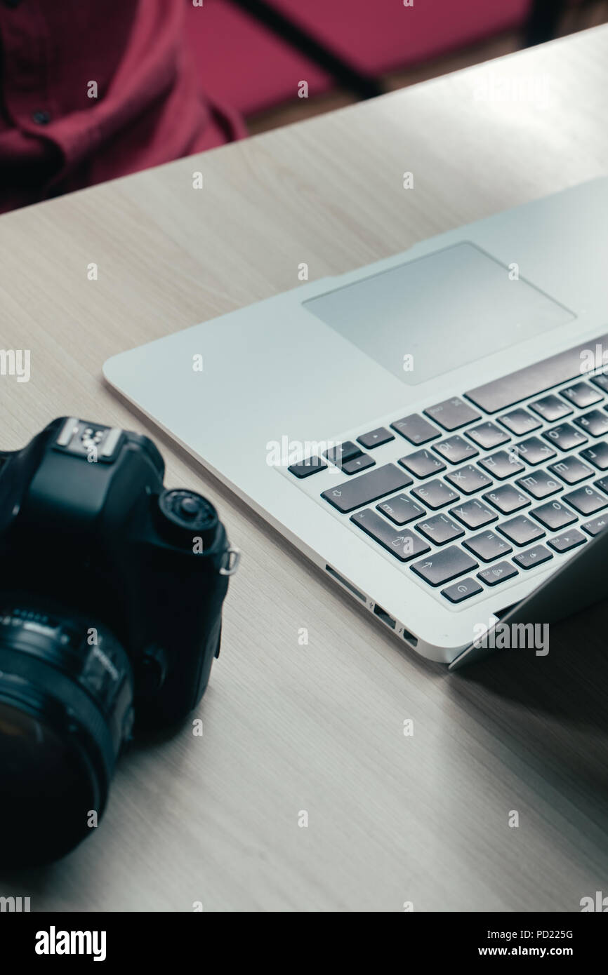 working table of photographer. new technologies concept. useful tools ...