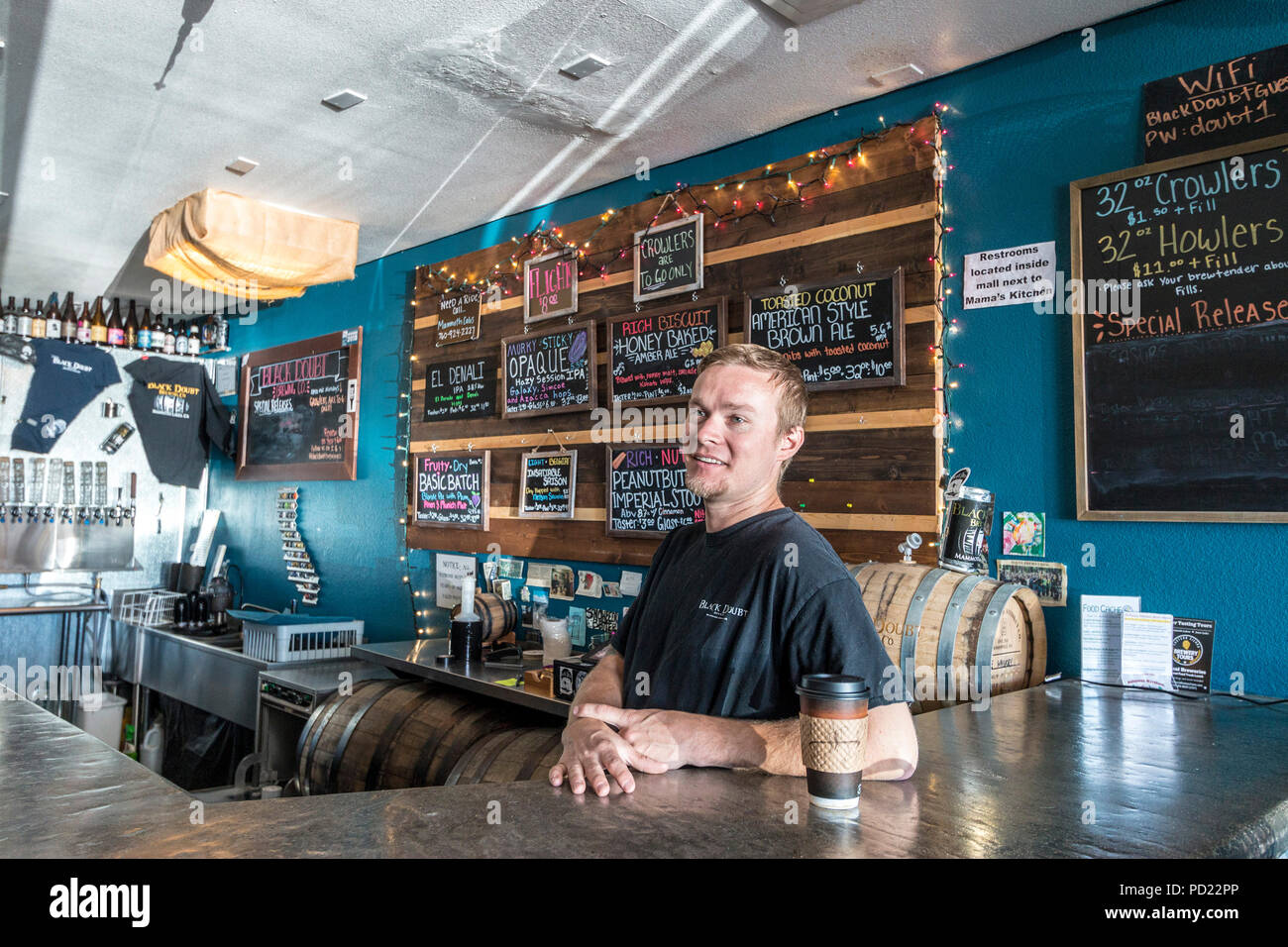 Owner Drew Wallace in Black Doubt, a nano-brewery in Mammoth Lakes with a wide range of specialty beers inclluding some truly unique ones including 'Peanut Butter Imperial Stout.' Stock Photo