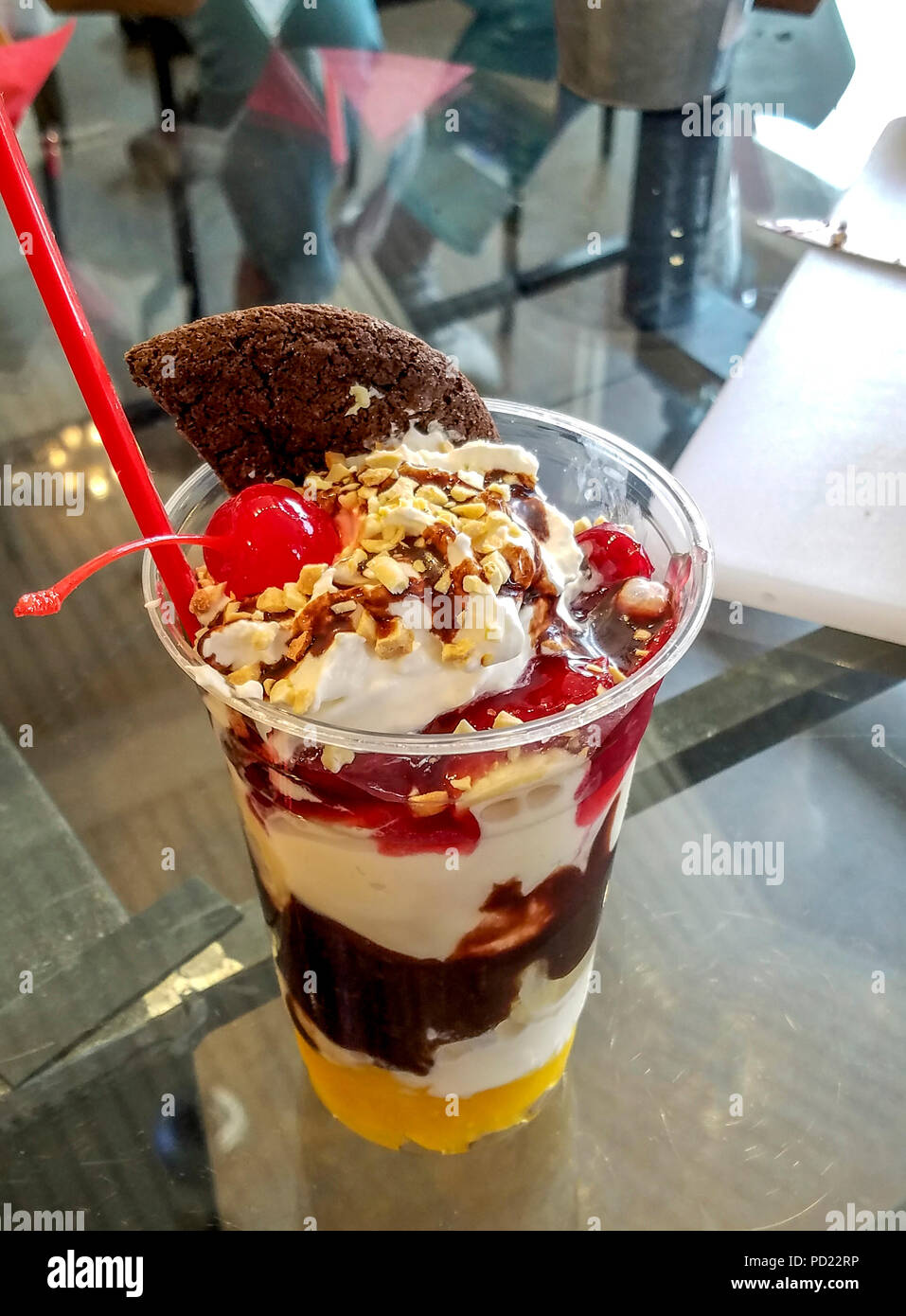 Baked Gorilla, a banana split in a cup...vanilla ice cream, pineapple, strawberries, hot fudge, whipped cream, peanuts & that chocolate cookie. Yes, we ate it all. At Mammoth Fun Shop. Stock Photo