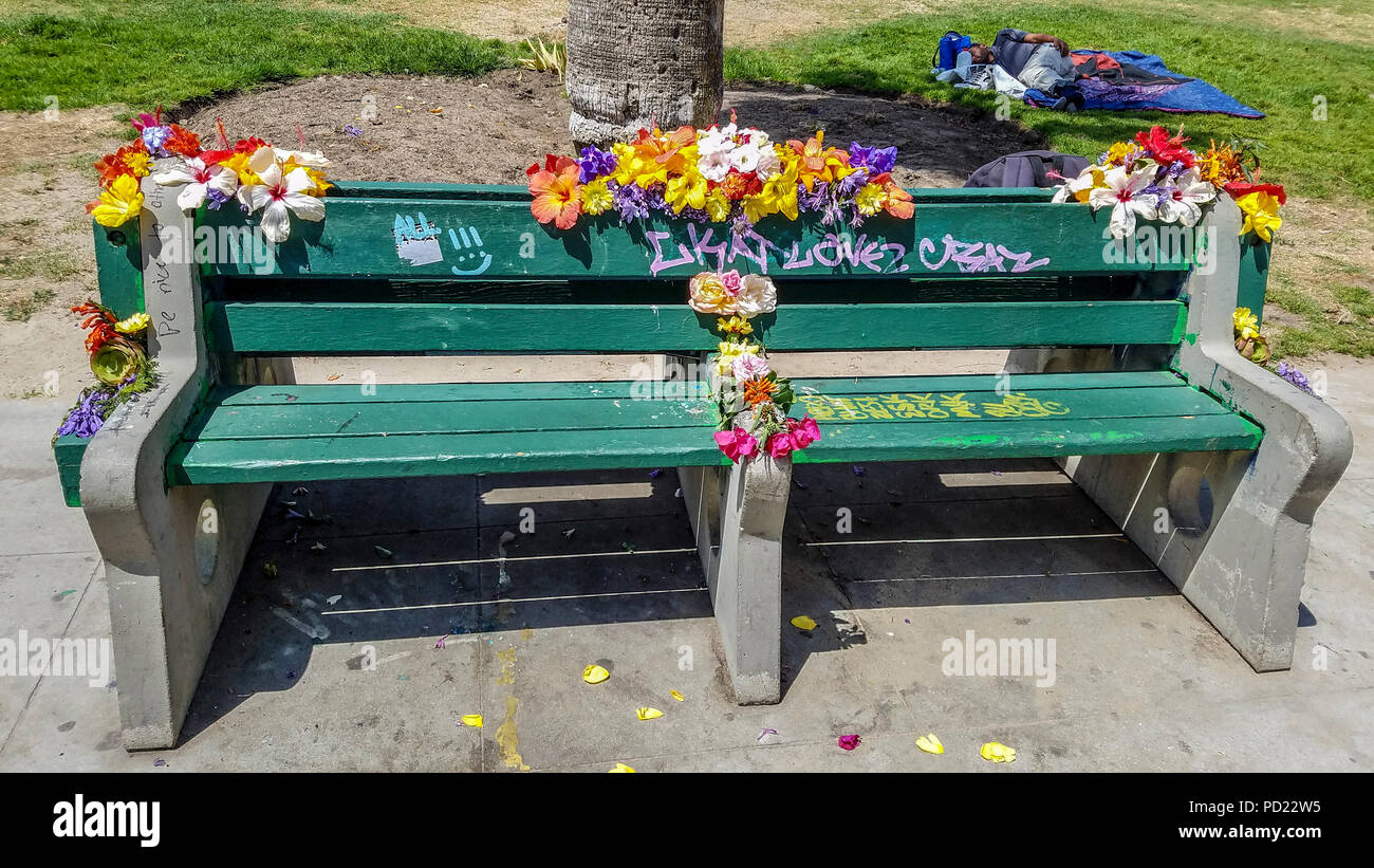 Flower covered bench along Venice Beach, CA. Stock Photo