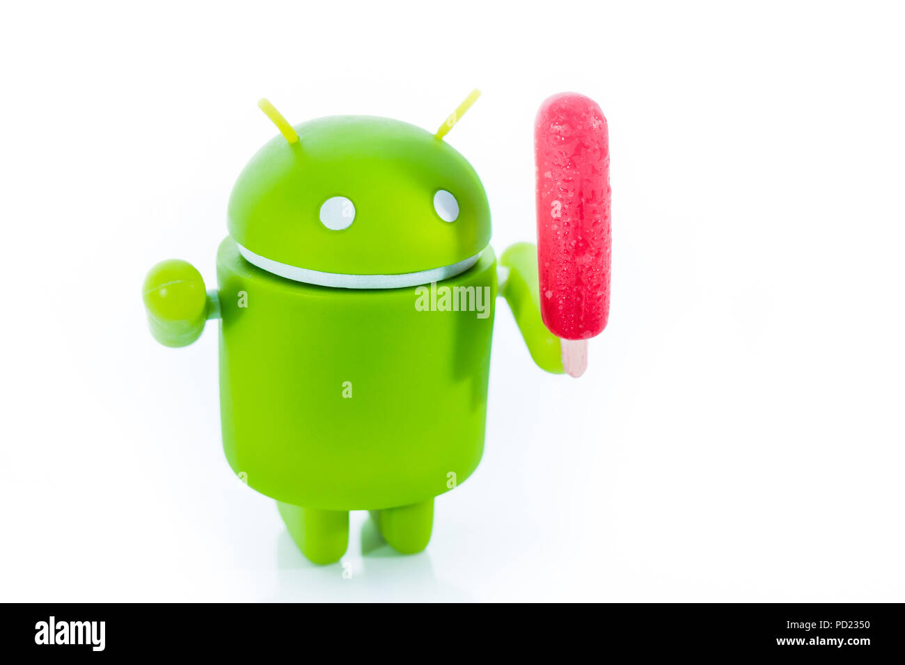 An Android figure with a popsicle Stock Photo