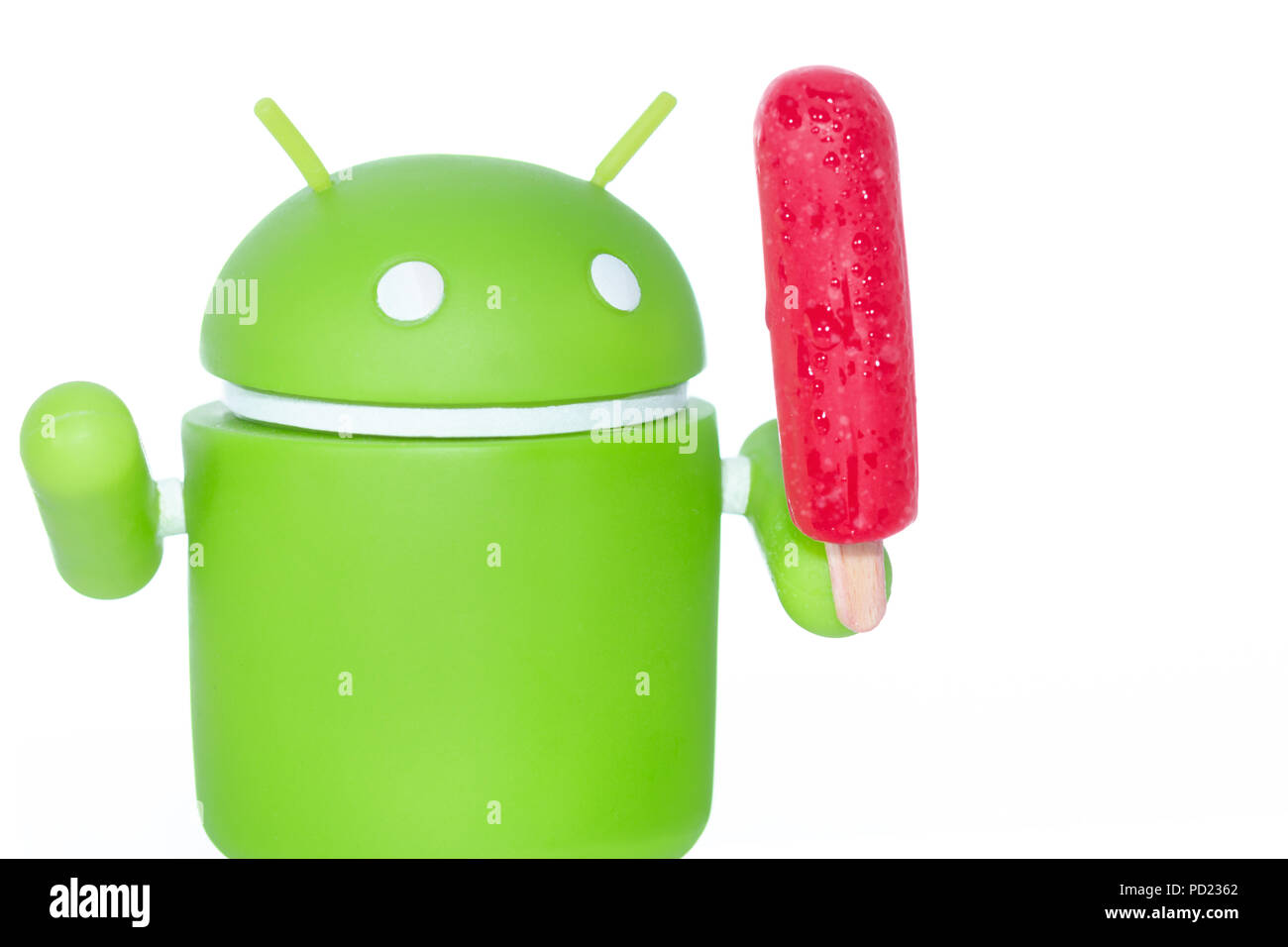 An Android figure with a popsicle Stock Photo