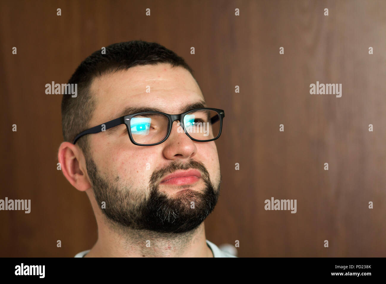 Portrait Of Handsome Bearded Black Haired Intelligent Modern Young