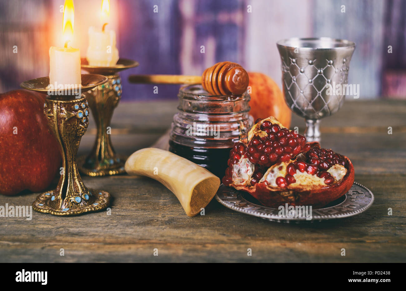 Rosh hashanah jewish New Year holiday concept. shofar, honey and pomegranate Traditional symbols