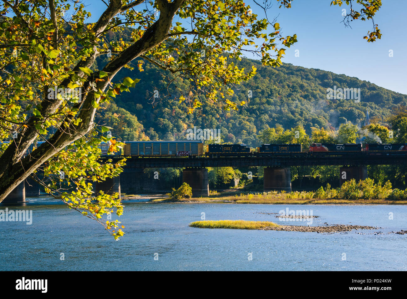 A train crossing the Potomac River in Harpers Ferry, West Virginia. Stock Photo
