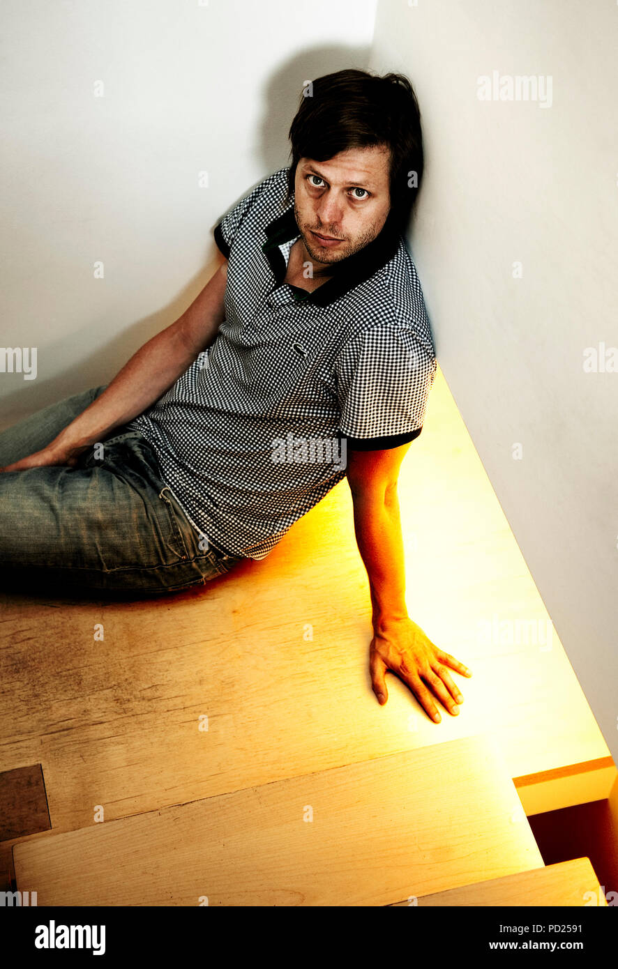 Belgian movie director Felix Van Groeningen in his flat in Antwerp (Belgium, 08/07/2009) Stock Photo