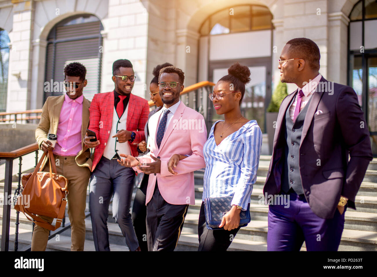 african youth gang.african friends sticking together. togetherness concept. side view photo. travelers from Africa going sightseeing Stock Photo