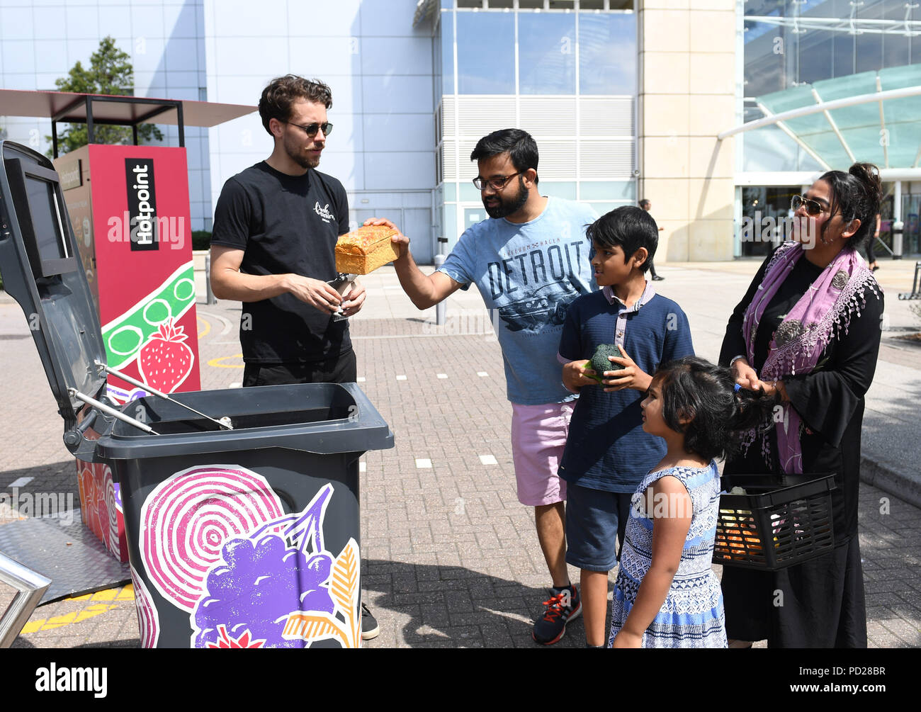 Members of the public throw food into the Hotpoint interactive food